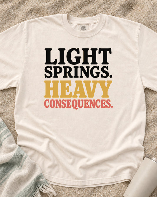 Ivory Comfort Colors 1717 tee with Light Springs. Heavy Consequences graphic.