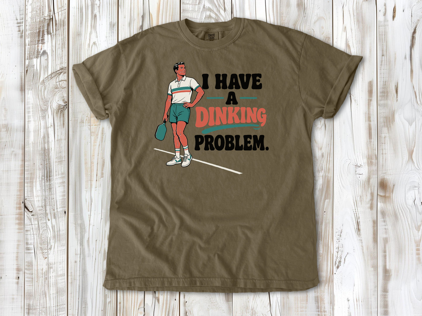 Graphite garment-dyed tee with I Have a Dinking Problem pickleball graphic.