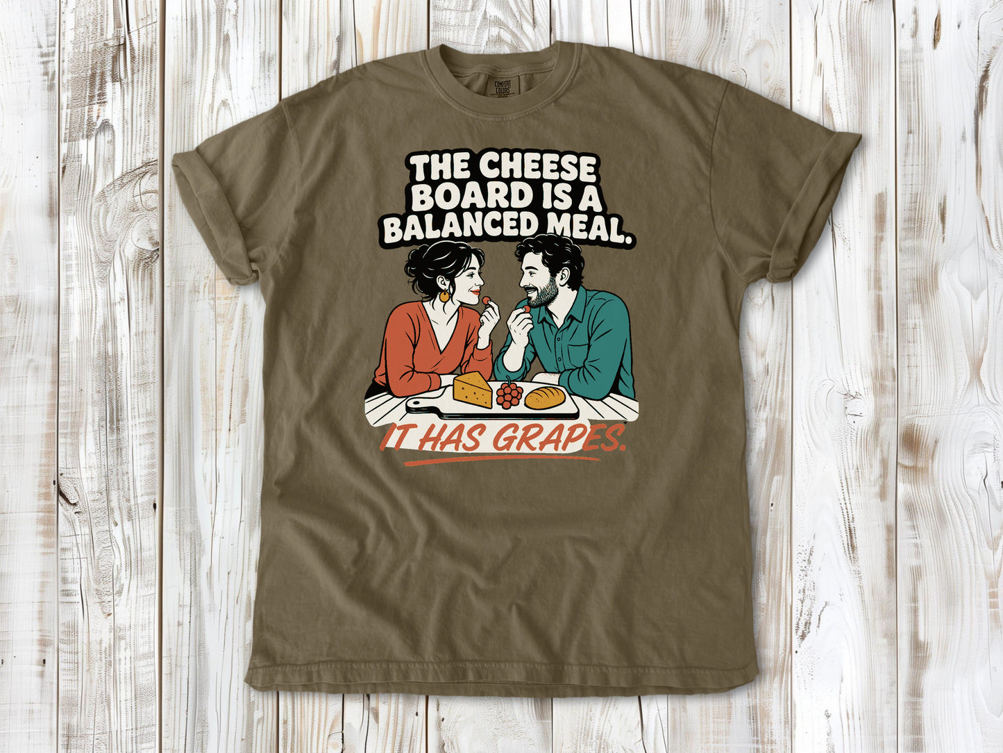 Graphite garment-dyed tee with The Cheese Board Is a Balanced Meal It Has Grapes graphic.