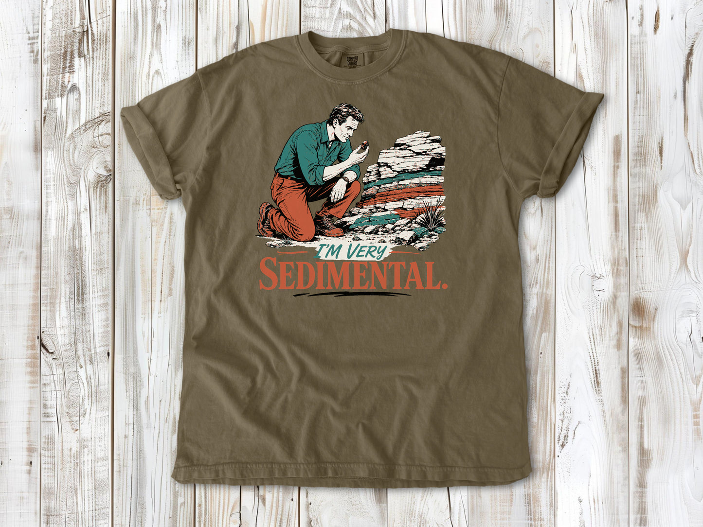 Graphite garment-dyed tee with I'm Very Sedimental rockhound graphic.