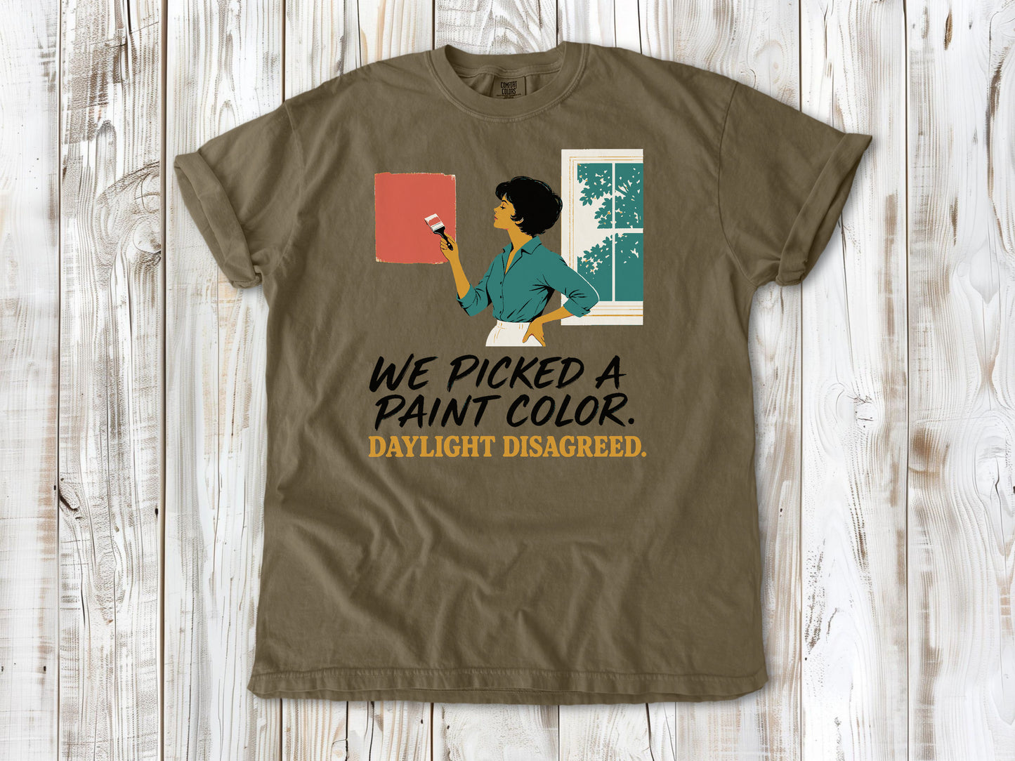Graphite garment-dyed tee with We Picked a Paint Color Daylight Disagreed painting graphic.