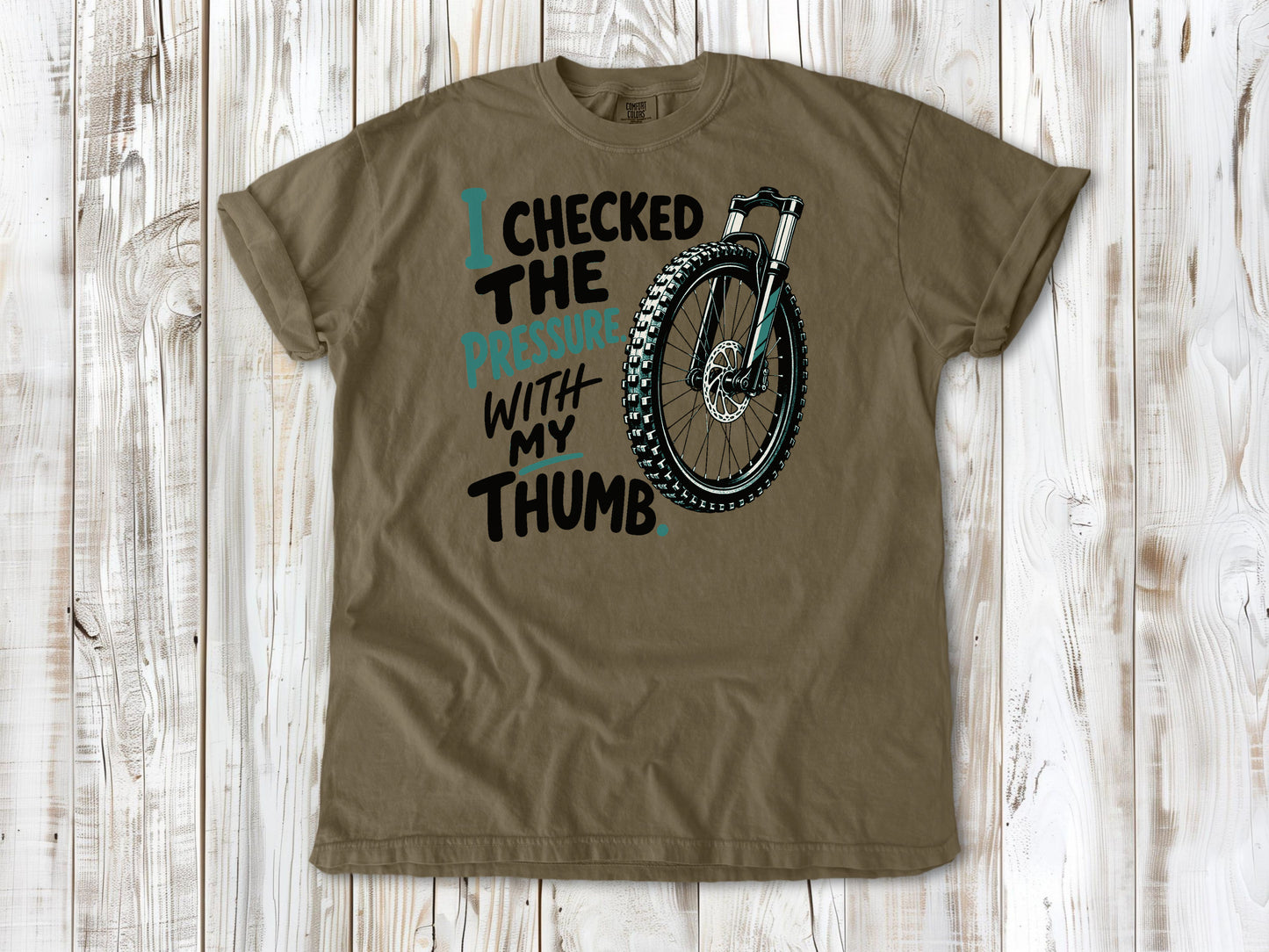 Graphite garment-dyed tee with I Checked the Pressure With My Thumb mountain bike tire graphic.
