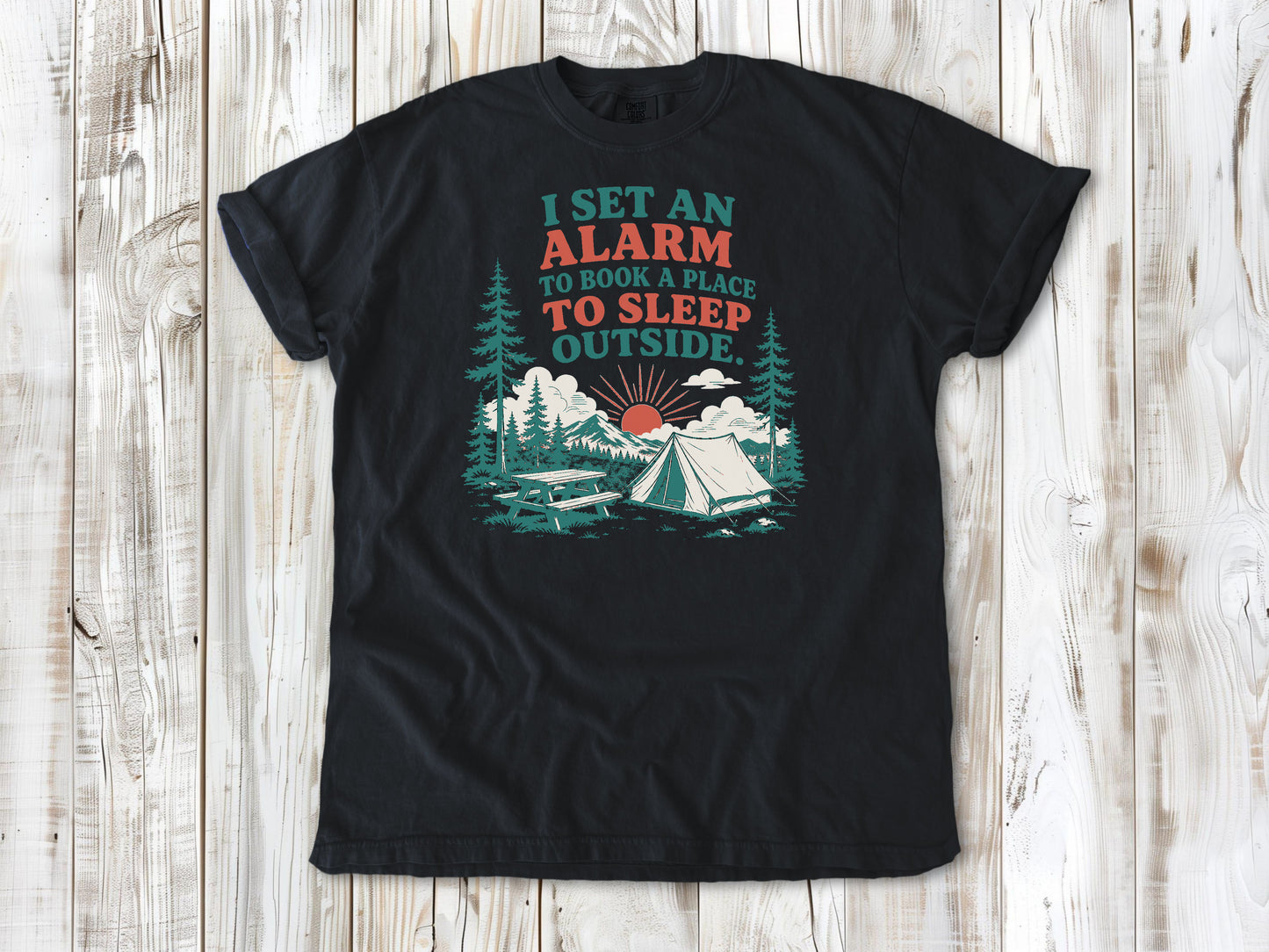 Graphite garment-dyed tee with I Set an Alarm to Book a Place to Sleep Outside camping graphic.