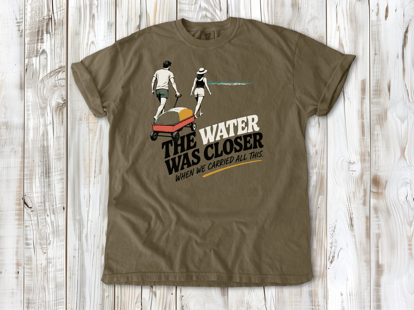 Graphite garment-dyed tee with The Water Was Closer When We Carried All This beach graphic.