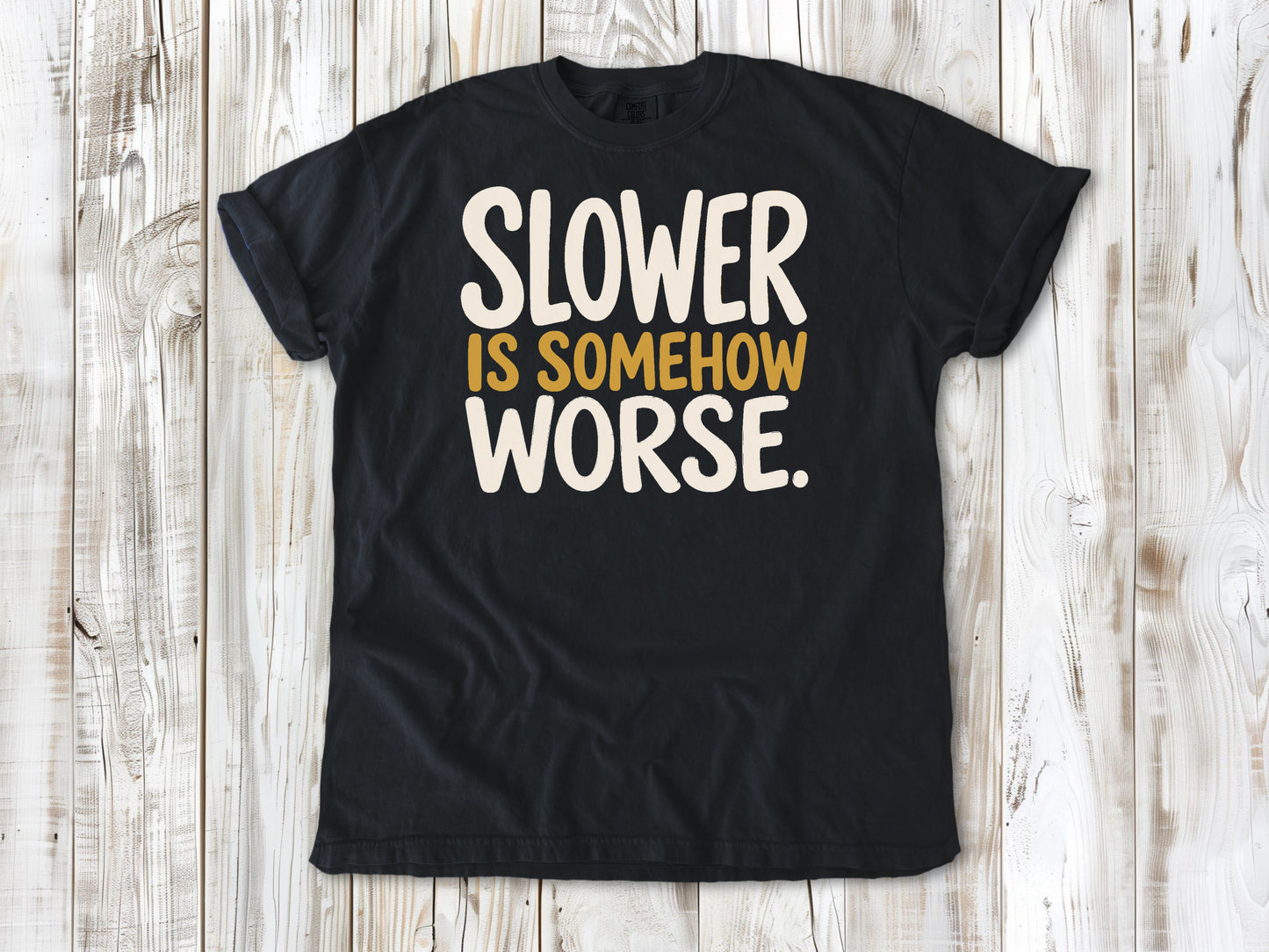 Graphite garment-dyed tee with Slower Is Somehow Worse Pilates workout graphic.