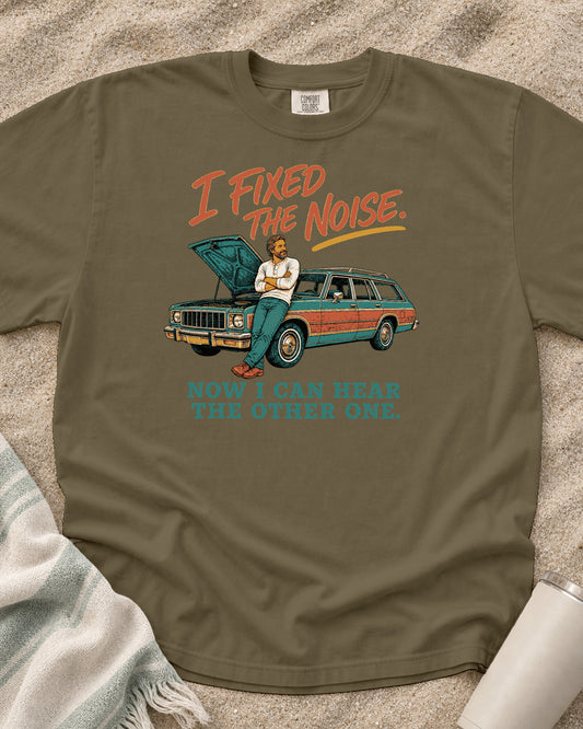 Khaki Comfort Colors 1717 tee with I Fixed the Noise. Now I Can Hear the Other One graphic.