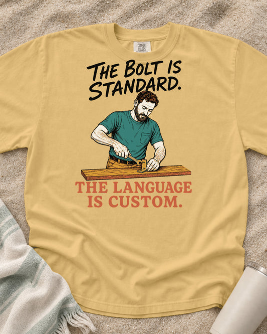 Mustard Comfort Colors 1717 tee with The Bolt Is Standard. The Language Is Custom graphic.