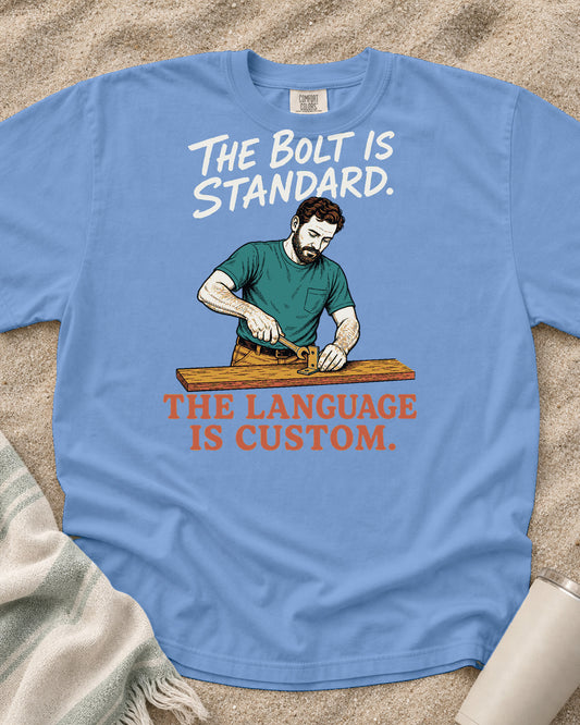 Washed Denim Comfort Colors 1717 tee with The Bolt Is Standard. The Language Is Custom graphic.