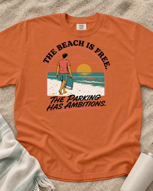 Burnt Orange Comfort Colors 1717 tee with The Beach Is Free. The Parking Has Ambitions graphic.