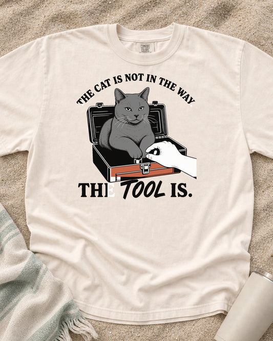 Ivory Comfort Colors 1717 tee with The Cat Is Not in the Way. The Tool Is graphic.