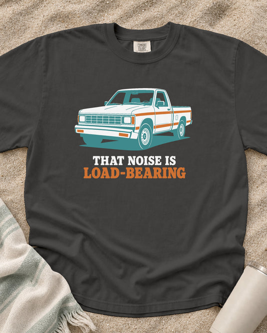 Pepper Comfort Colors 1717 tee with That Noise Is Load-Bearing graphic.