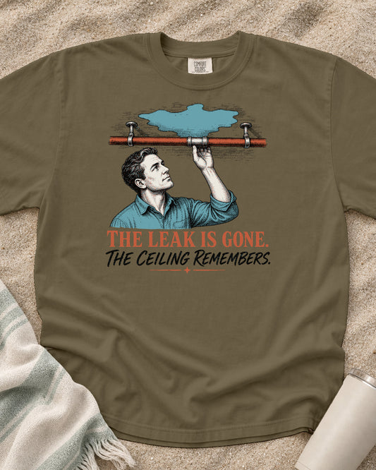 Khaki Comfort Colors 1717 tee with The Leak Is Gone. The Ceiling Remembers graphic.