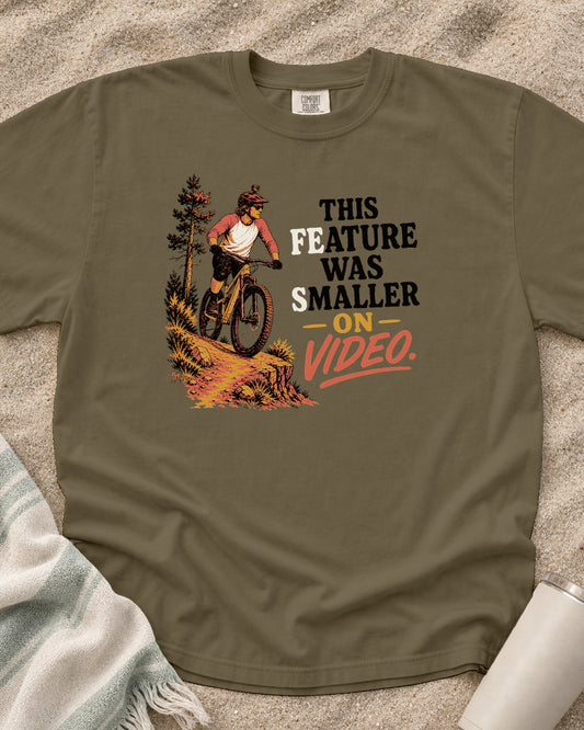 Khaki Comfort Colors 1717 tee with This Feature Was Smaller on Video graphic.