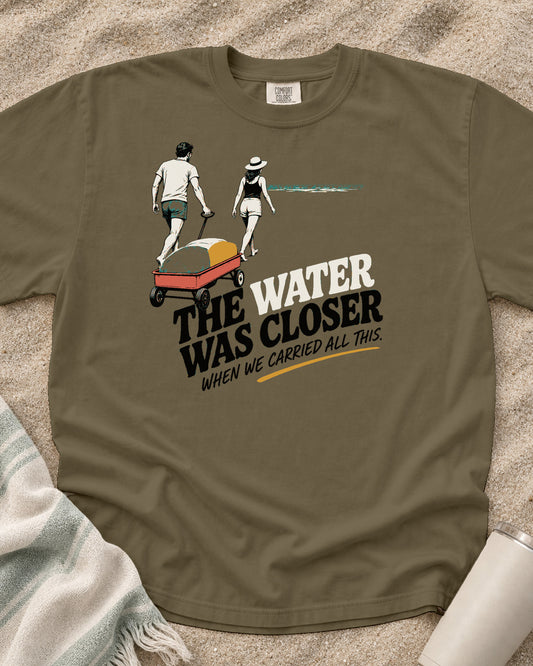 Khaki Comfort Colors 1717 tee with The Water Was Closer When We Carried All This graphic.