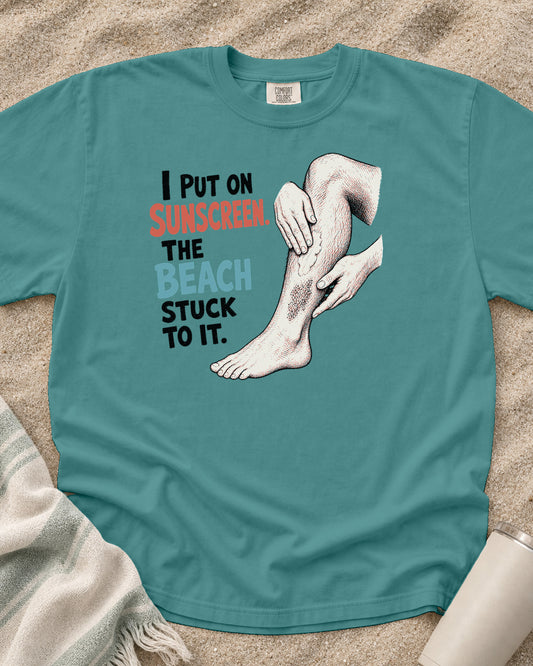 Seafoam Comfort Colors 1717 tee with I Put on Sunscreen. The Beach Stuck to It graphic.