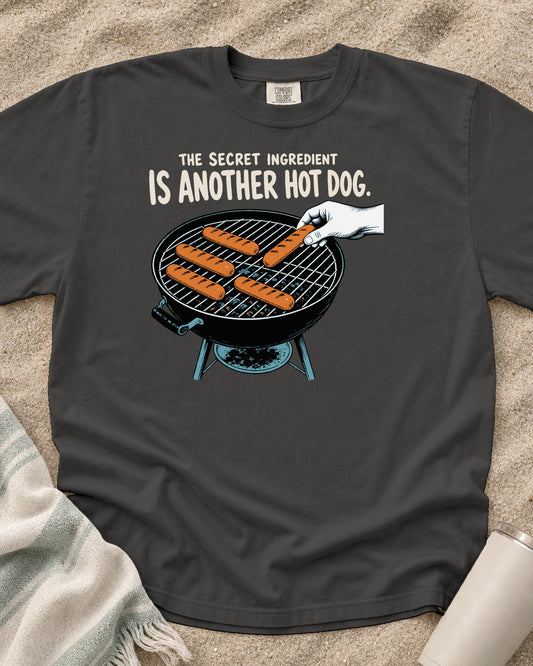 Pepper Comfort Colors 1717 tee with The Secret Ingredient Is Another Hot Dog graphic.