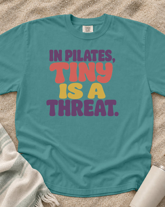Seafoam Comfort Colors 1717 tee with In Pilates, Tiny Is a Threat graphic.