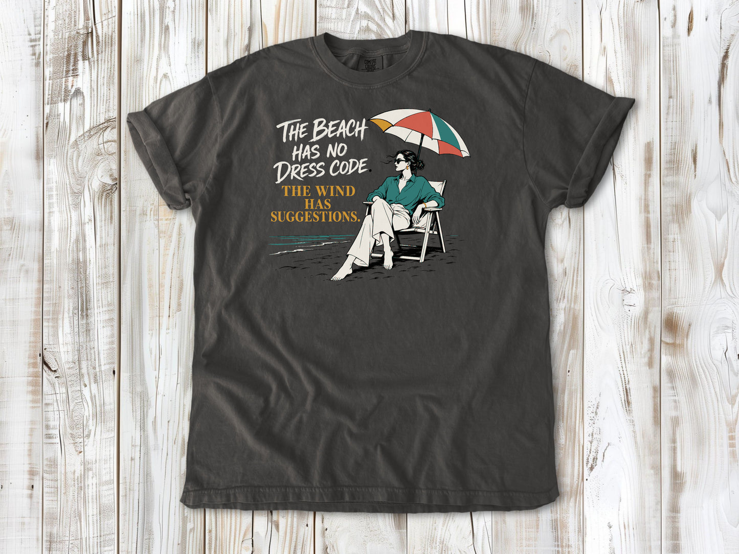 The Beach Has No Dress Code. The Wind Has Suggestions. Tee