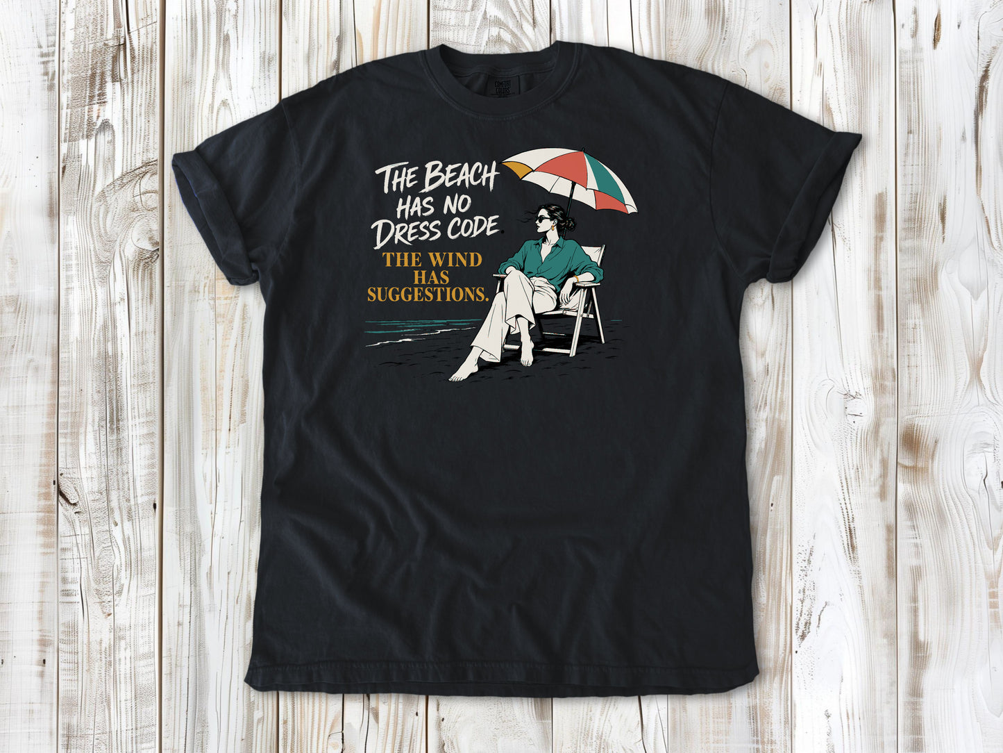 The Beach Has No Dress Code. The Wind Has Suggestions. Tee