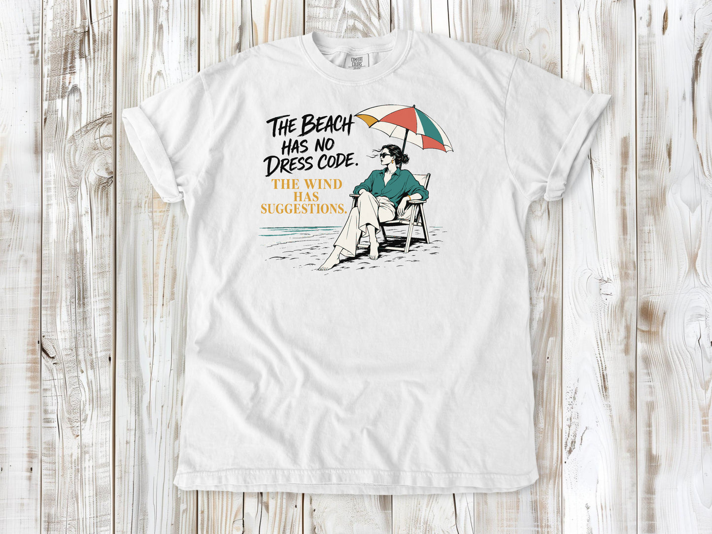 The Beach Has No Dress Code. The Wind Has Suggestions. Tee