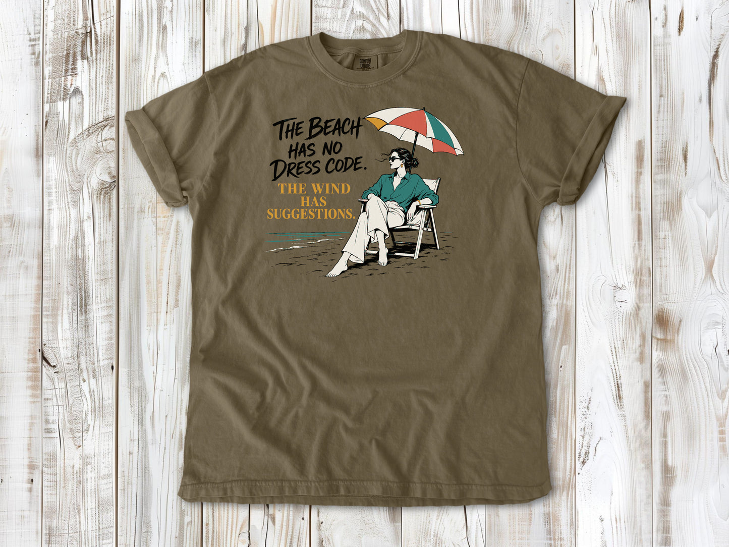 The Beach Has No Dress Code. The Wind Has Suggestions. Tee