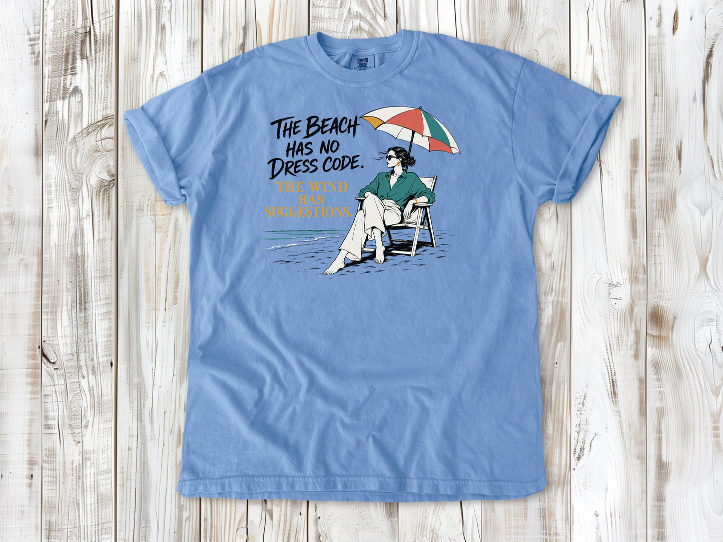 The Beach Has No Dress Code. The Wind Has Suggestions. Tee