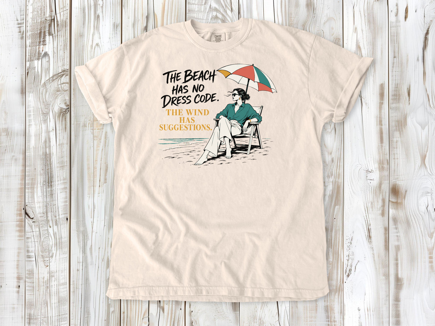 The Beach Has No Dress Code. The Wind Has Suggestions. Tee