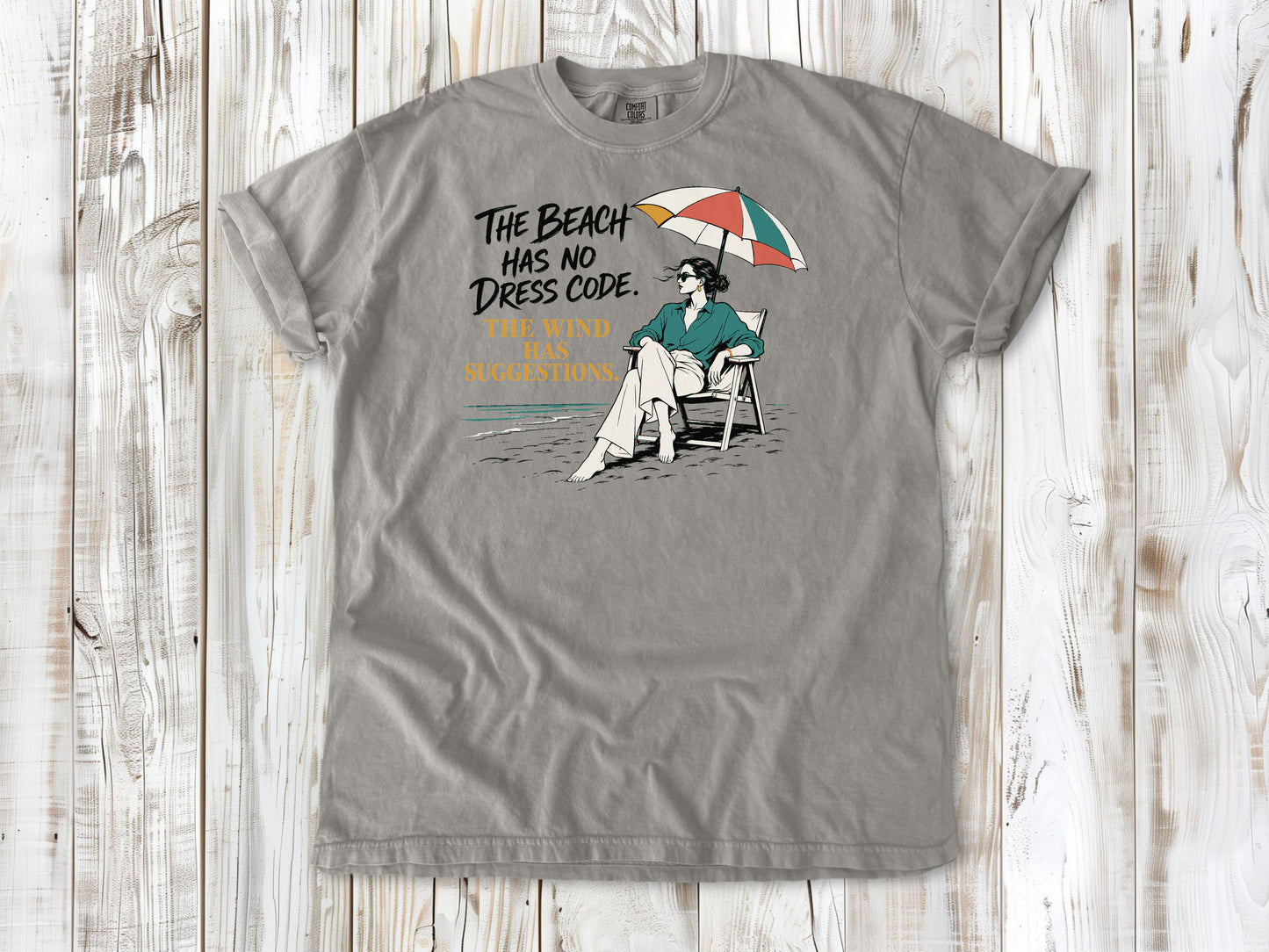 The Beach Has No Dress Code. The Wind Has Suggestions. Tee