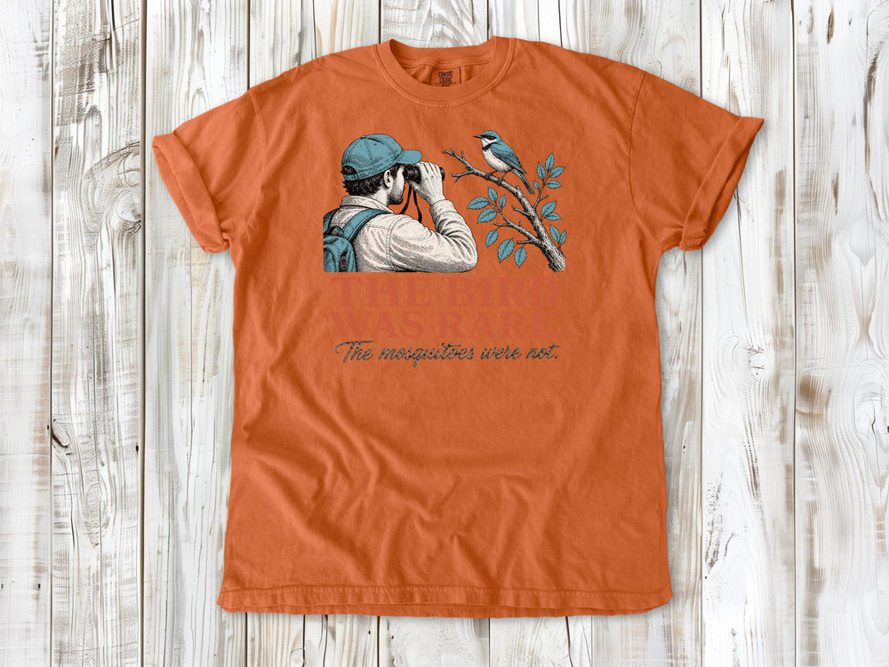 Seafoam garment-dyed tee with The Bird Was Rare The Mosquitoes Were Not birdwatching graphic.