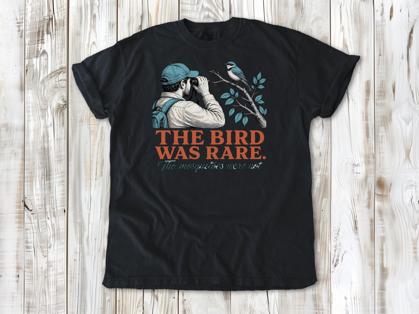 Washed Denim garment-dyed tee with The Bird Was Rare The Mosquitoes Were Not birdwatching graphic.
