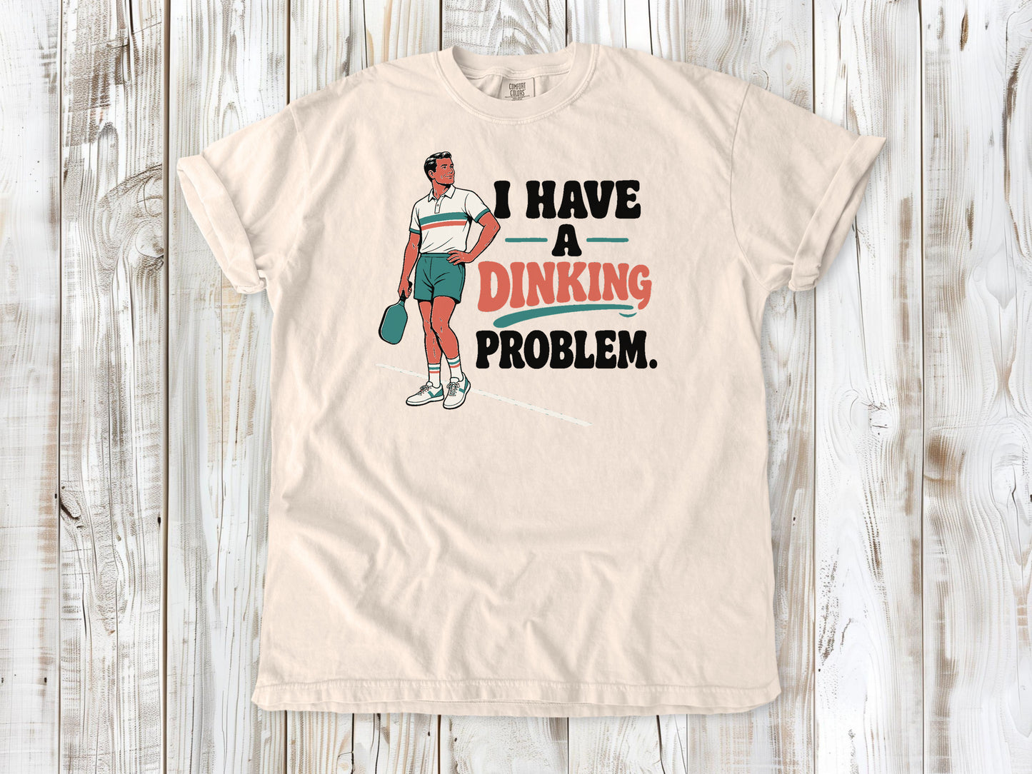 Butter garment-dyed tee with I Have a Dinking Problem pickleball graphic.