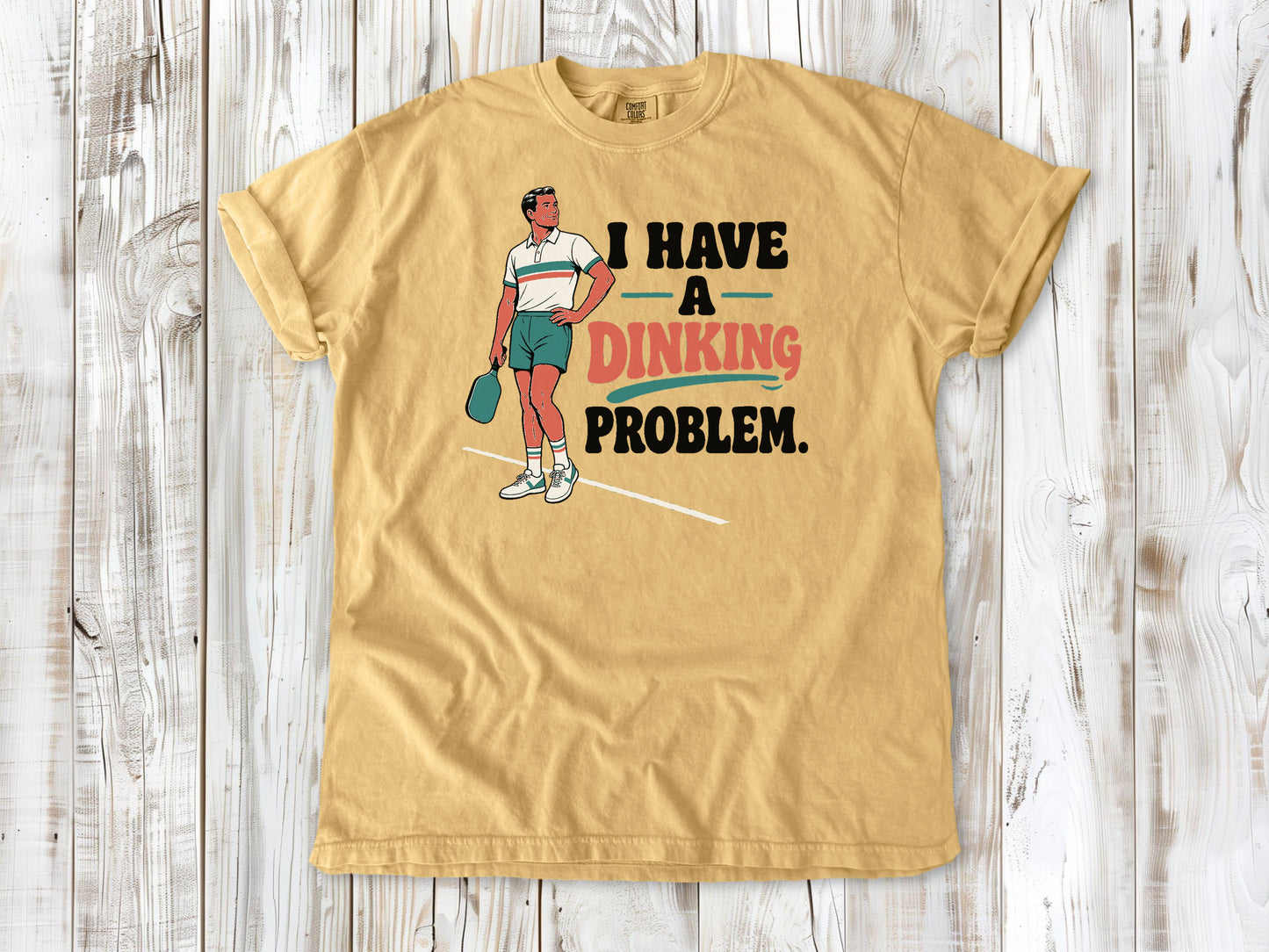 Burnt Orange garment-dyed tee with I Have a Dinking Problem pickleball graphic.