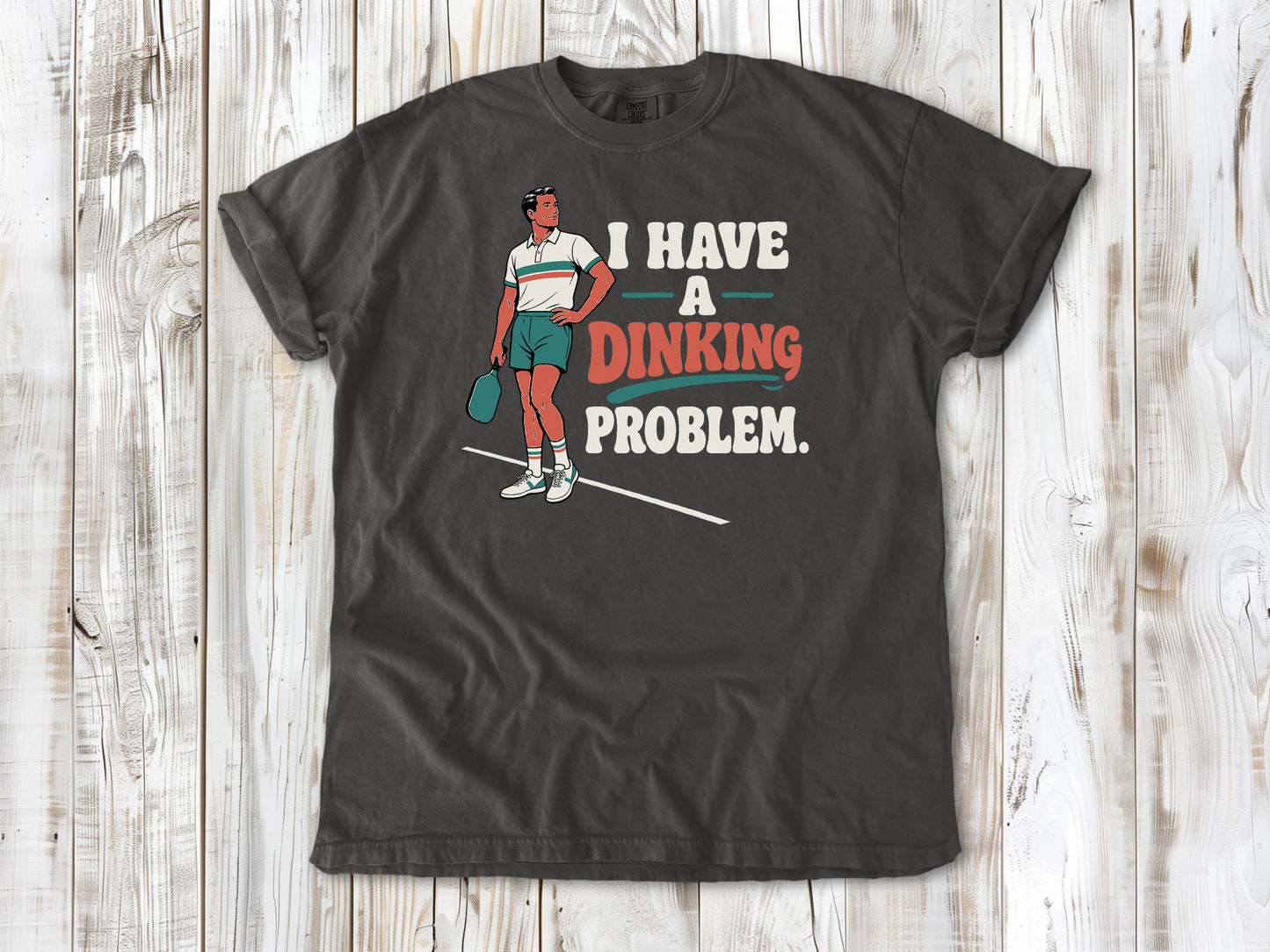 Ivory garment-dyed tee with I Have a Dinking Problem pickleball graphic.