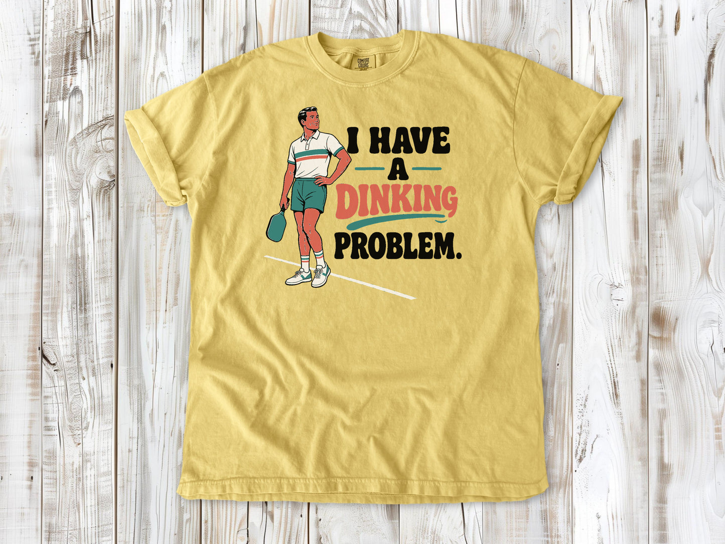 Grey garment-dyed tee with I Have a Dinking Problem pickleball graphic.