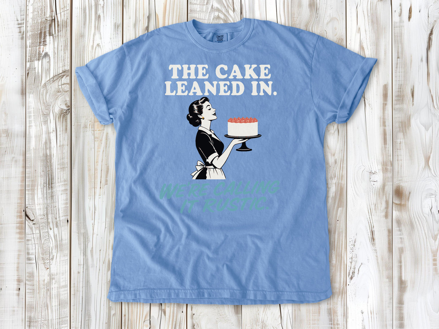 Pepper garment-dyed tee with The Cake Leaned In We're Calling It Rustic baking graphic.