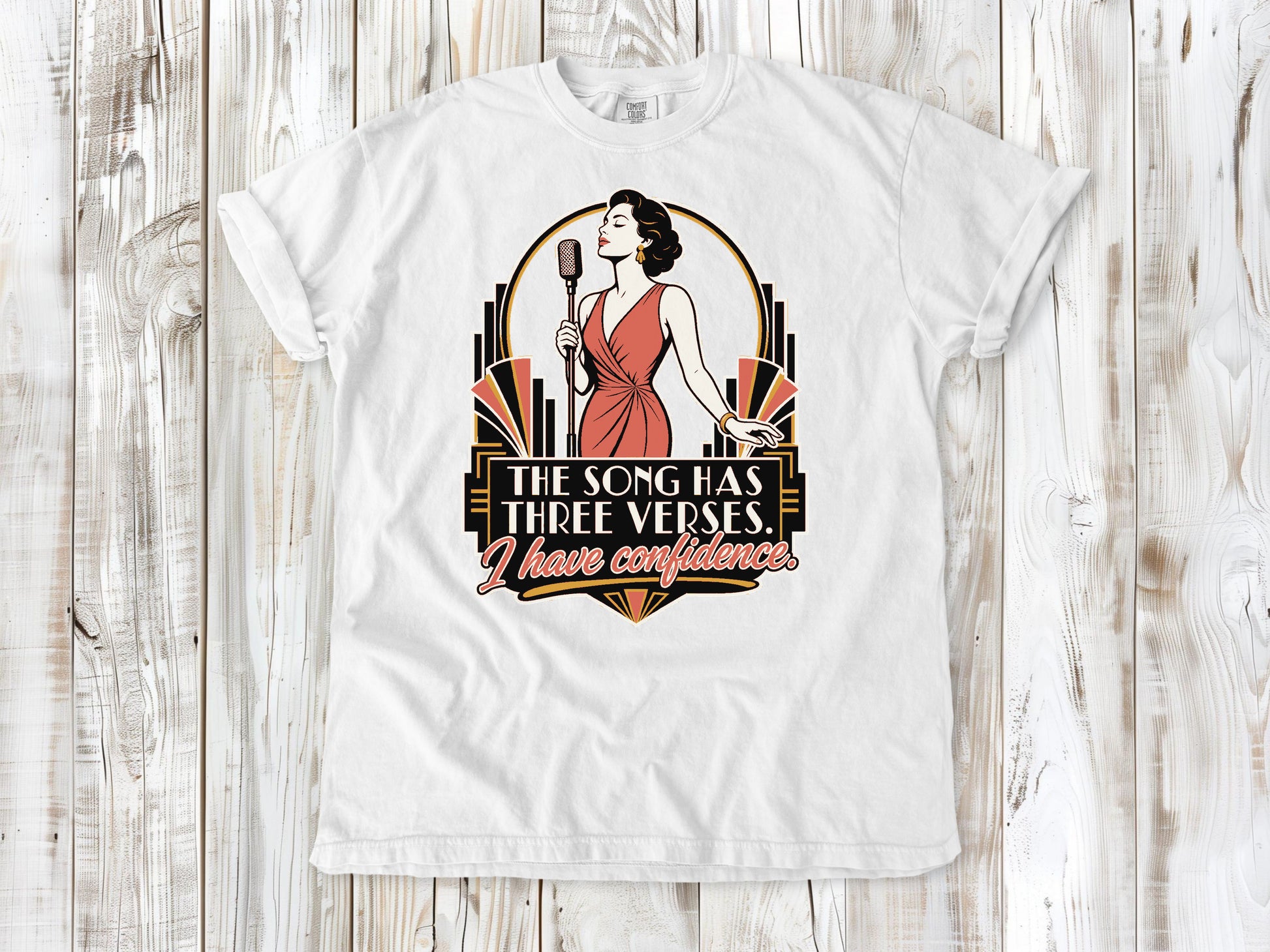 White garment-dyed tee with The Song Has Three Verses I Have Confidence singing graphic.