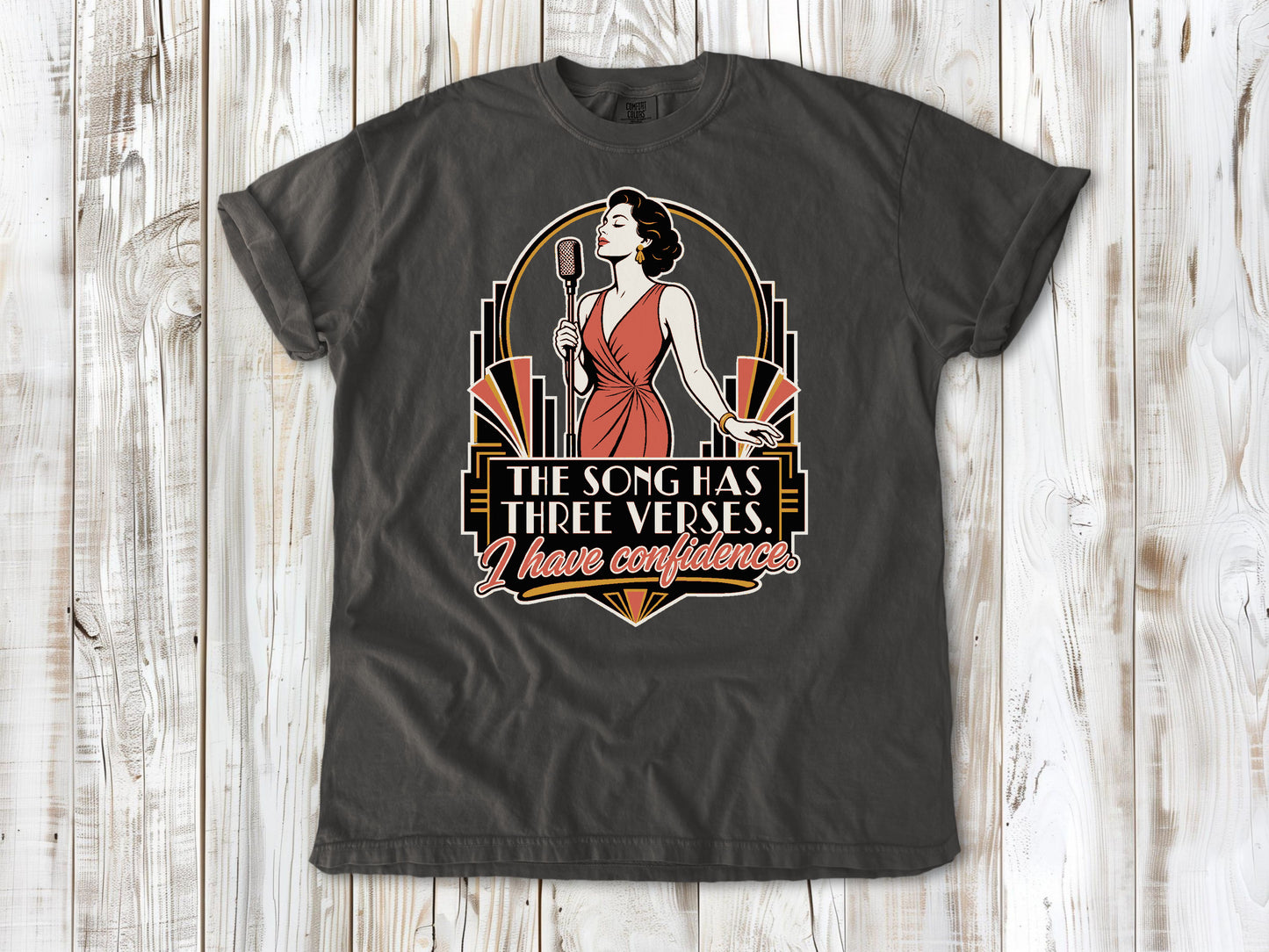 Ivory garment-dyed tee with The Song Has Three Verses I Have Confidence singing graphic.