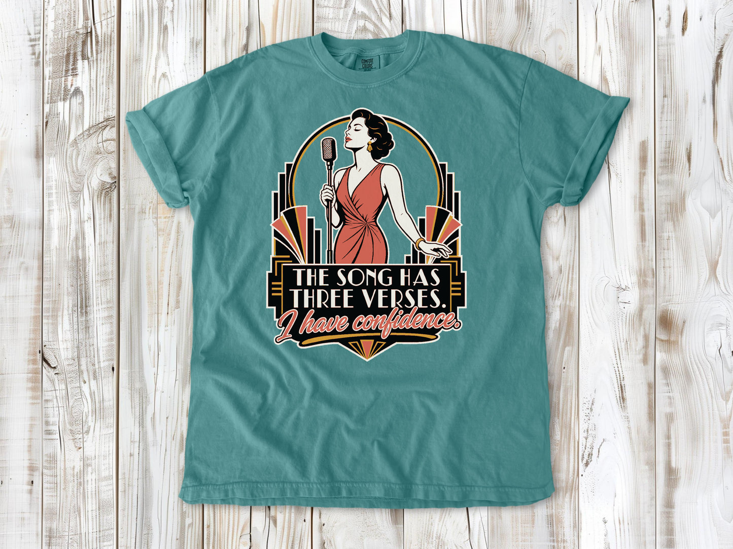 Mustard garment-dyed tee with The Song Has Three Verses I Have Confidence singing graphic.