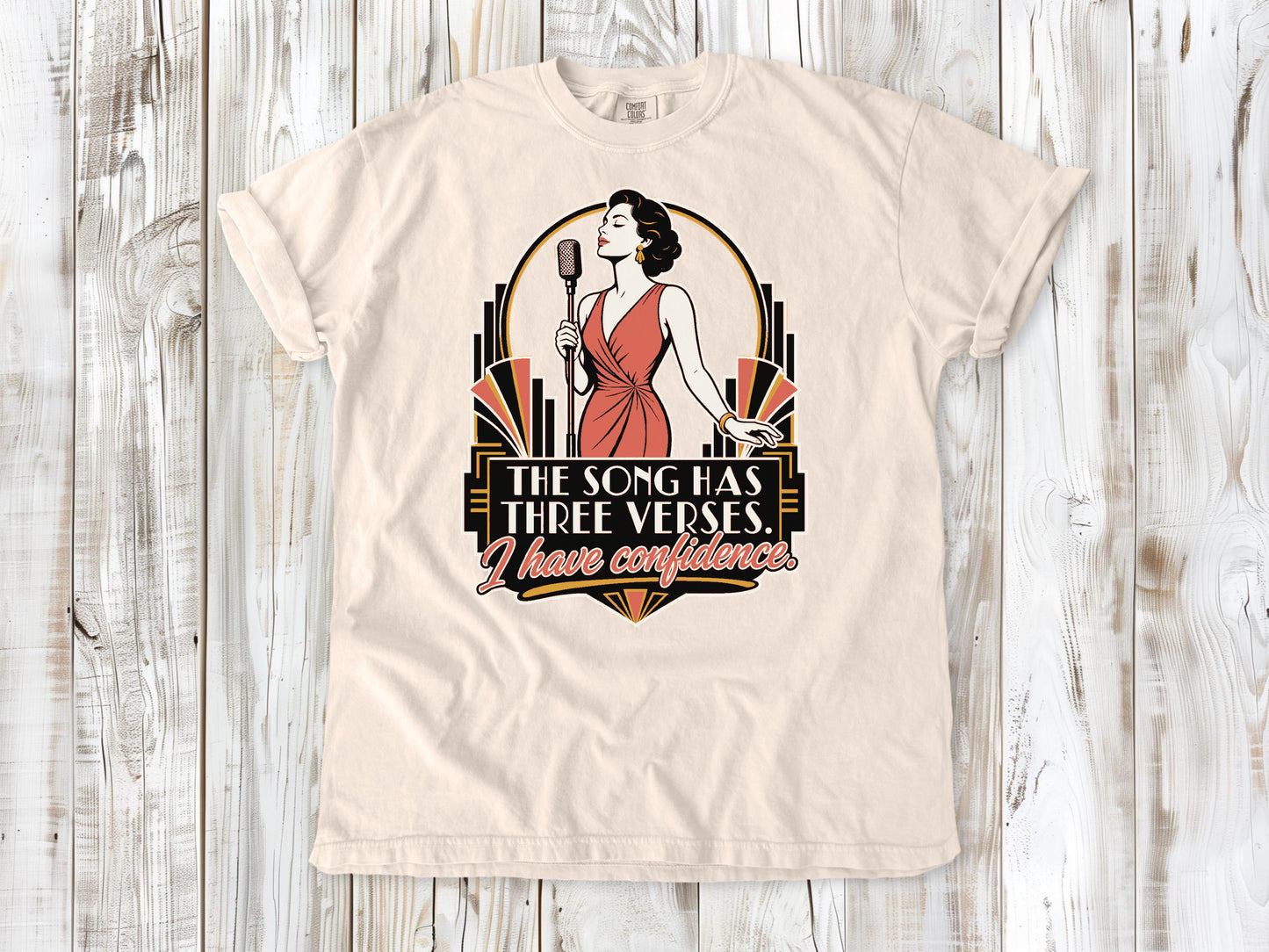 Butter garment-dyed tee with The Song Has Three Verses I Have Confidence singing graphic.