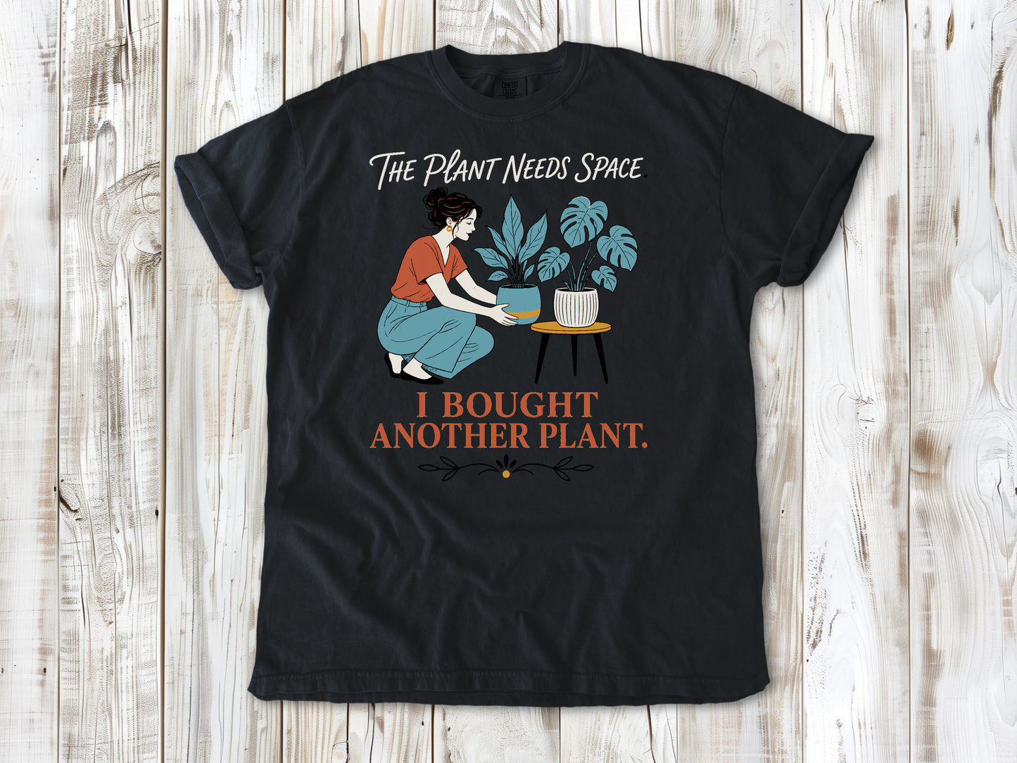 Washed Denim garment-dyed tee with The Plant Needs Space I Bought Another Plant houseplant graphic.