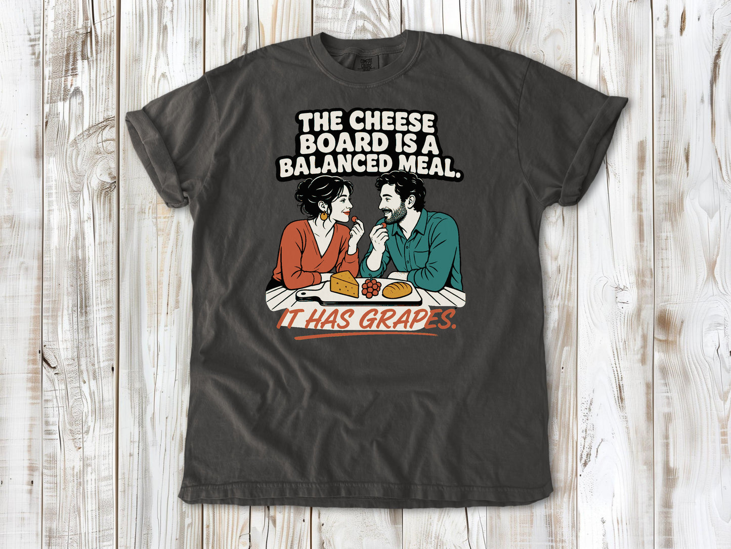Ivory garment-dyed tee with The Cheese Board Is a Balanced Meal It Has Grapes graphic.