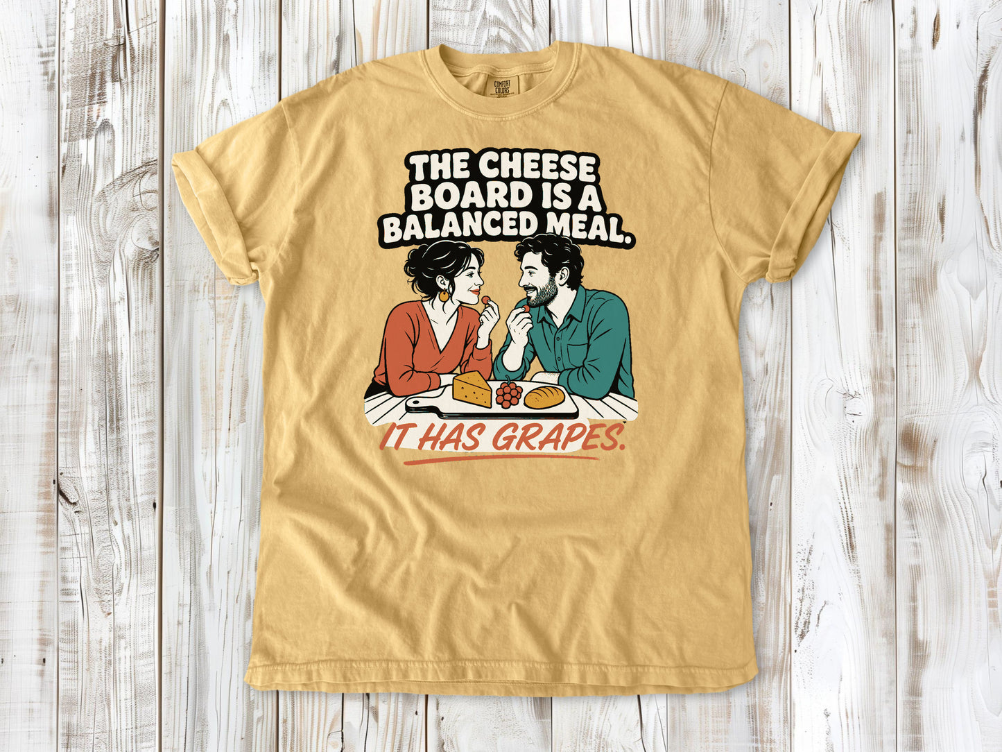 Burnt Orange garment-dyed tee with The Cheese Board Is a Balanced Meal It Has Grapes graphic.