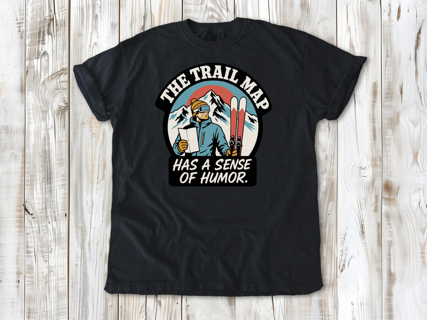 Washed Denim garment-dyed tee with The Trail Map Has a Sense of Humor hiking graphic.