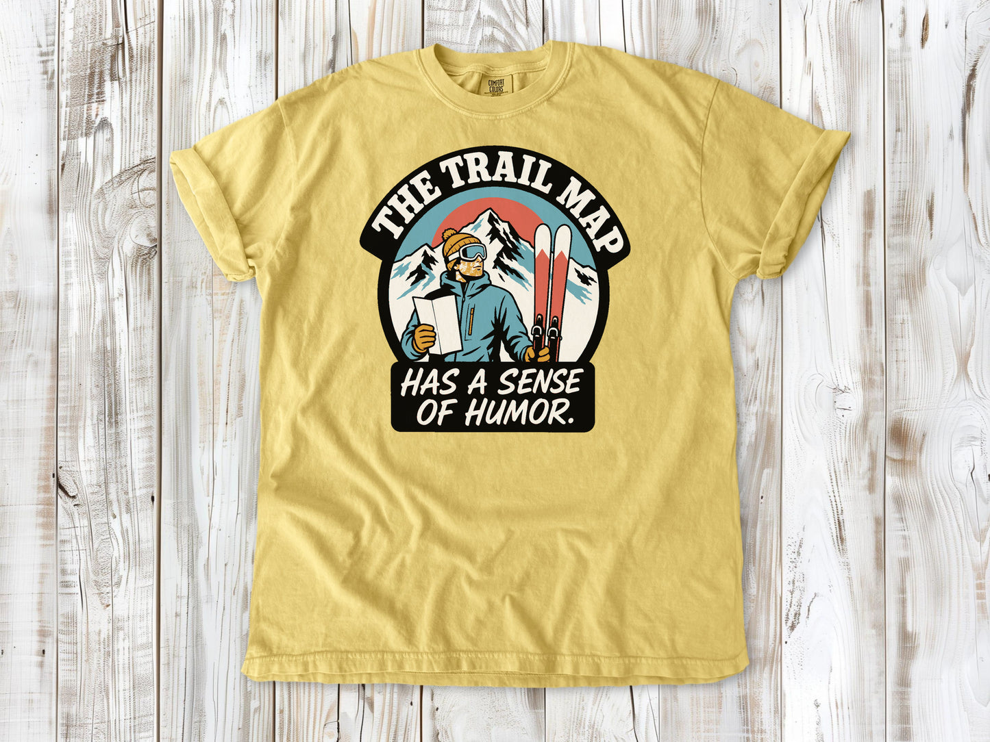 Grey garment-dyed tee with The Trail Map Has a Sense of Humor hiking graphic.
