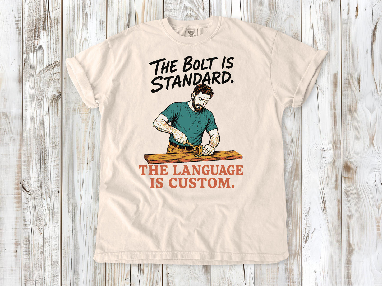 Butter garment-dyed tee with The Bolt Is Standard The Language Is Custom mechanic graphic.