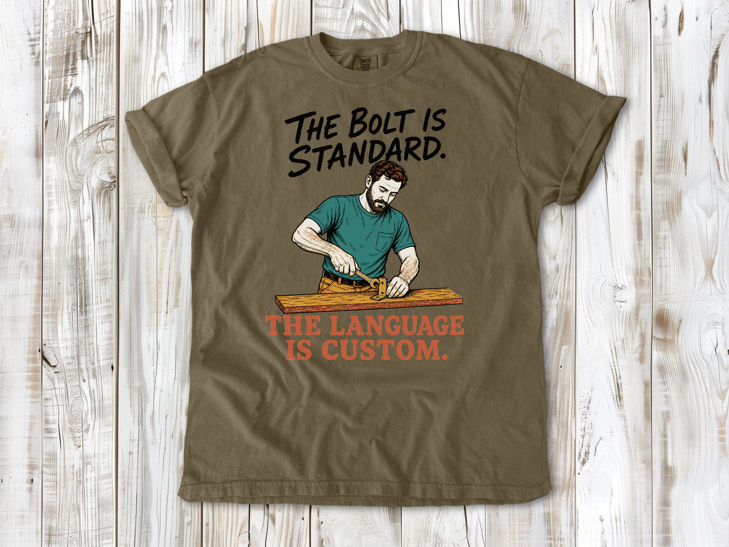 Graphite garment-dyed tee with The Bolt Is Standard The Language Is Custom mechanic graphic.