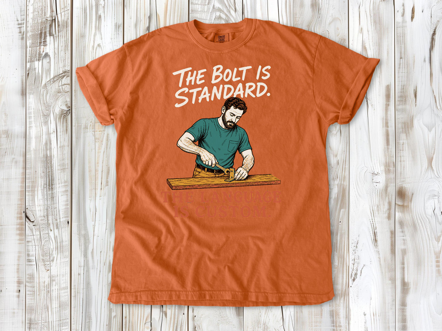 Seafoam garment-dyed tee with The Bolt Is Standard The Language Is Custom mechanic graphic.