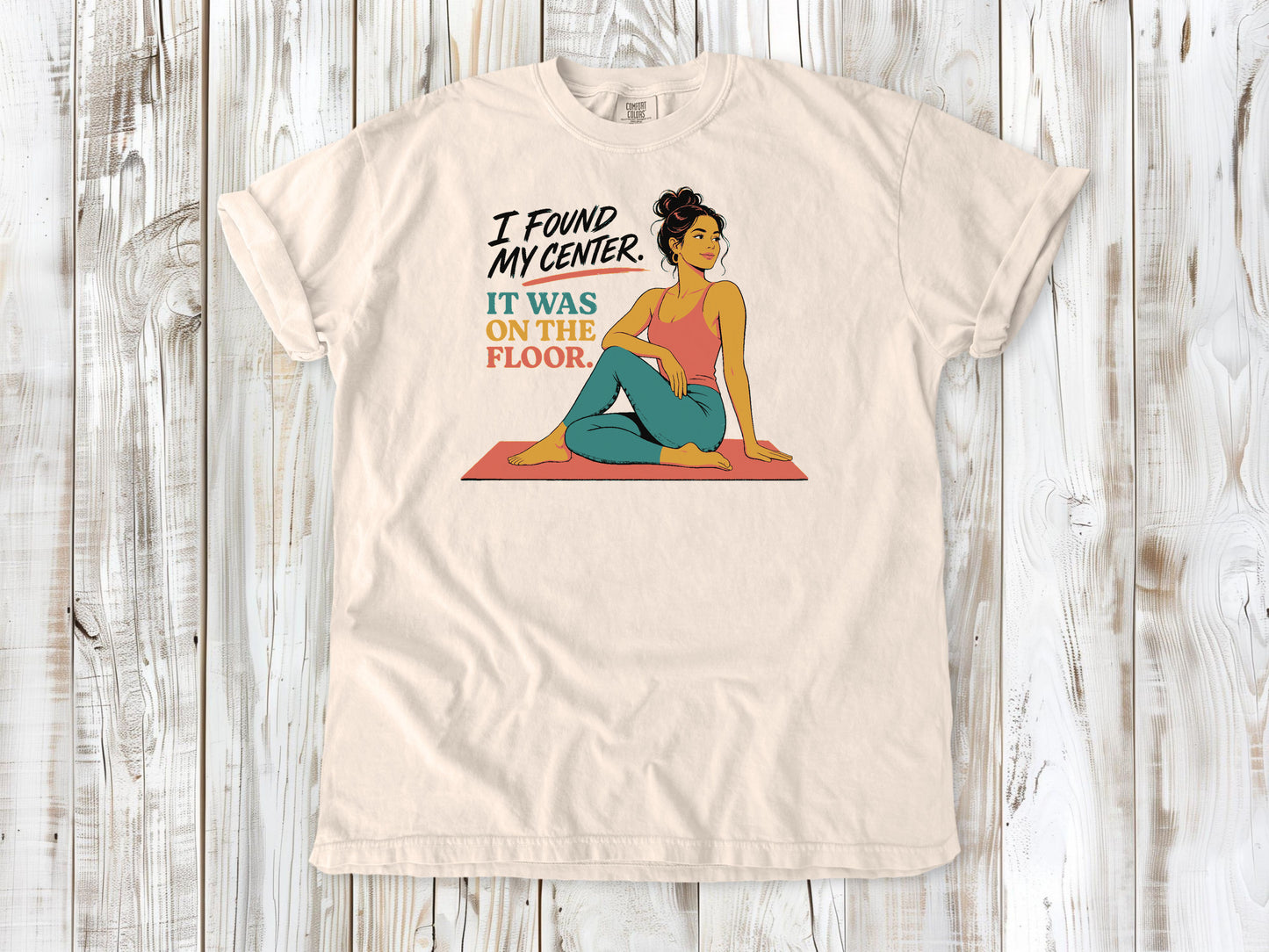 Butter garment-dyed tee with I Found My Center It Was on the Floor yoga graphic.