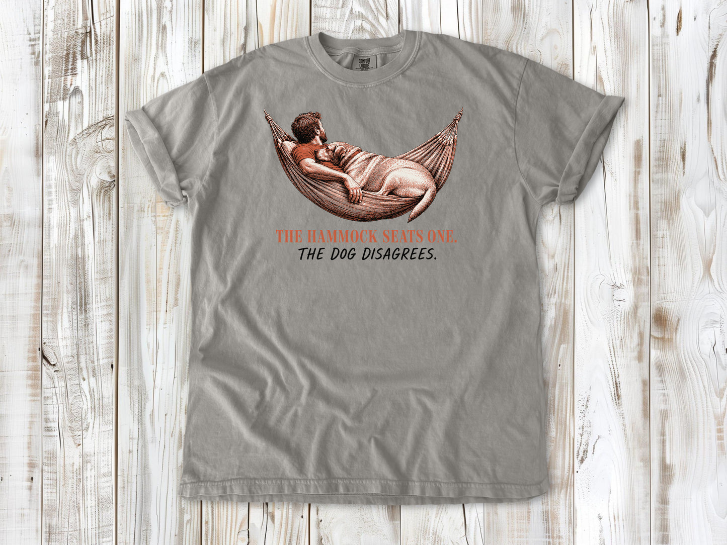 Khaki garment-dyed tee with The Hammock Seats One The Dog Disagrees dog graphic.