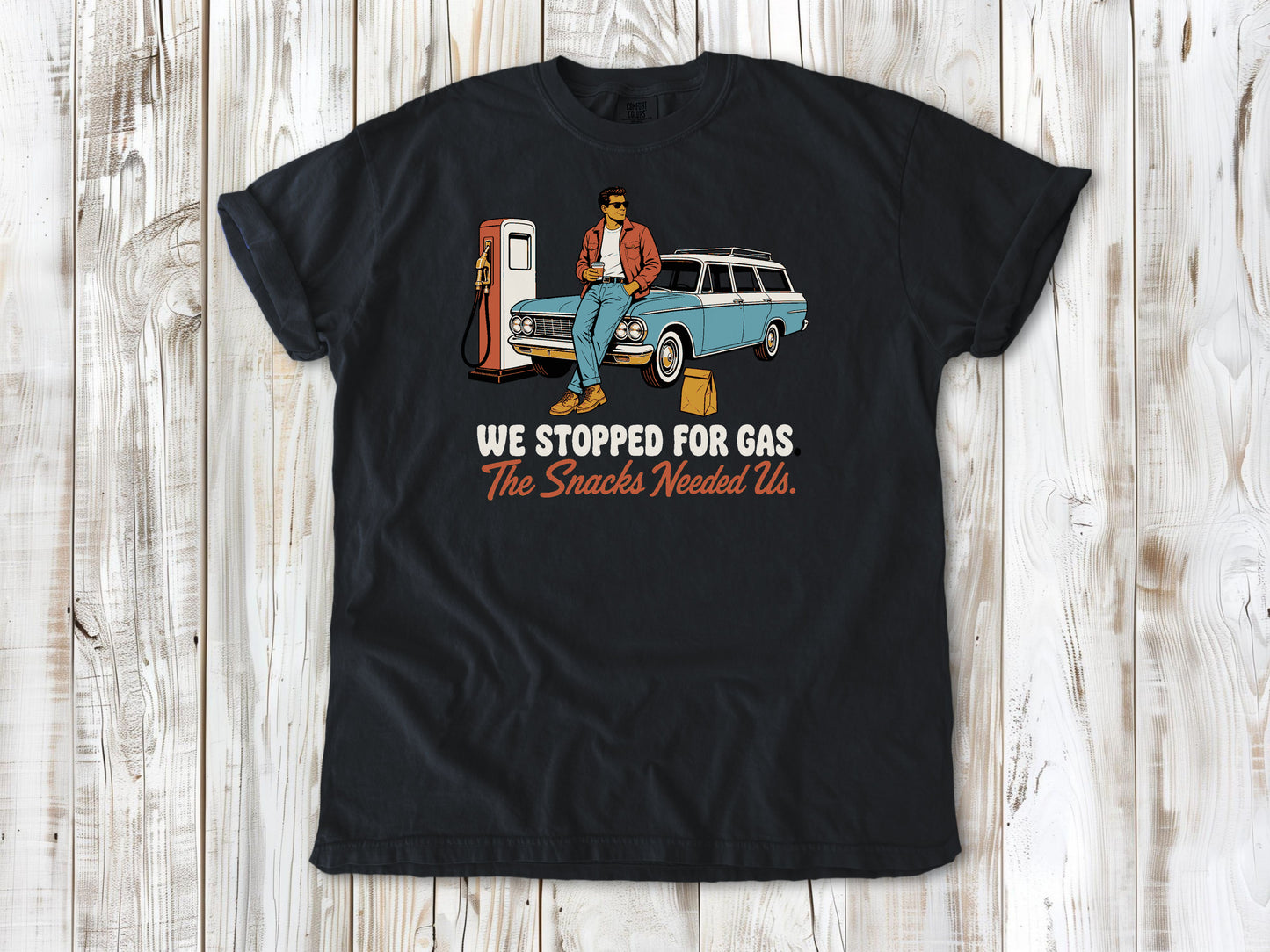 Washed Denim garment-dyed tee with We Stopped for Gas The Snacks Needed Us road trip graphic.